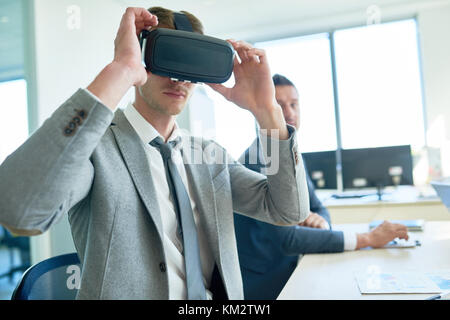 Handsome Businessman Using VR Glasses Stock Photo
