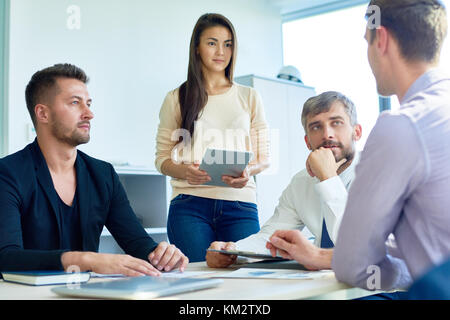 Business People Sharing Ideas in Meeting Stock Photo