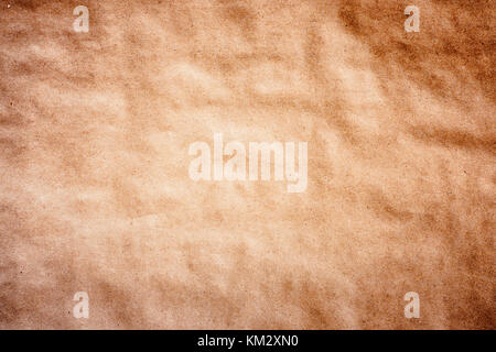 Texture detailed background craft wrapping wrinkled paper parchment recycled  vignetting toned macro shot Stock Photo