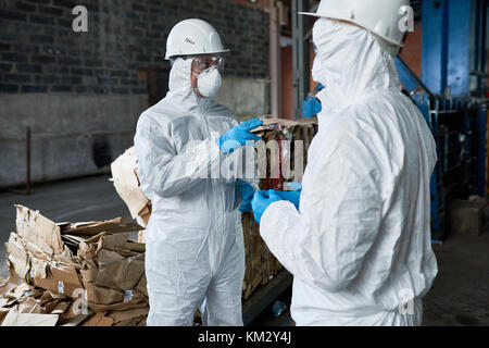 Workers in Recycling Plant Warehouse Stock Photo