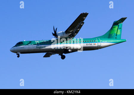 ATR 72 operated by Stobart Air on behalf of Aer Lingus Regional, Birmingham Airport, UK. ATR 72-600 EI-FAX St. Finian is seen on approach for landing. Stock Photo
