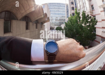 Personal perspective of a man answering a phone call on a smartwatch Stock Photo