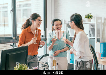 group of three people having the conversation and talking about the business joke. Stock Photo