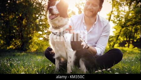 Man embracing his dog Stock Photo