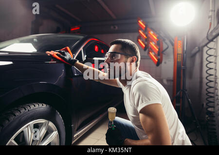 Car Detailing The Man Holds The Microfiber In Hand And Polishes The Car Stock Photo Alamy