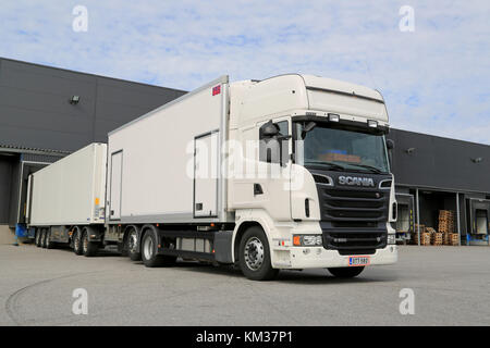 TURKU, FINLAND - MARCH 22, 2014: White Scania V8 truck and full trailer  parked. Scania truck with an Euro 6 engine wins Green Truck award for the  seco Stock Photo - Alamy