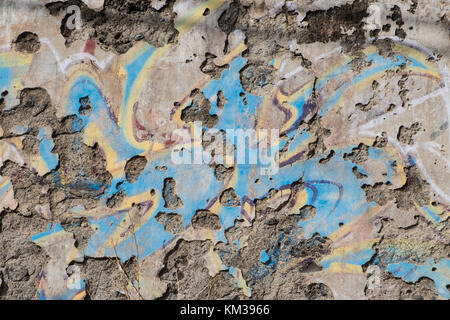 old wall background with peeling off plaster and paint remains Stock Photo