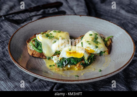 Eggs benedicts on toast, close up view. Stock Photo