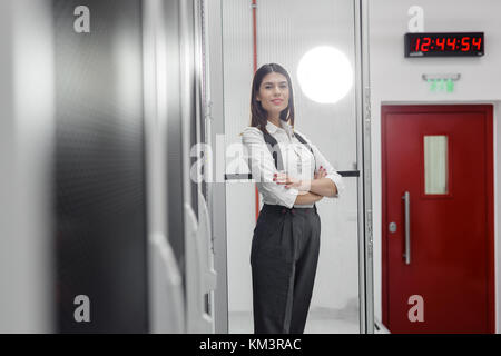 Portrait of woman in server room Stock Photo