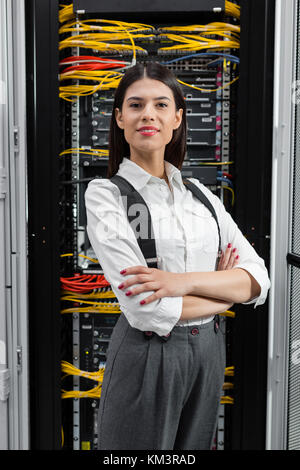 Portrait of woman in server room Stock Photo