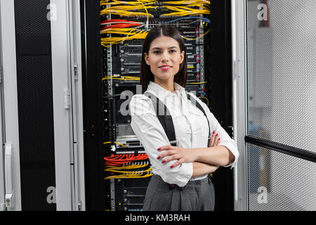 Portrait of woman in server room Stock Photo