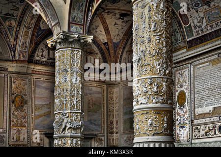 The Palazzo Vecchio in the 'Piazza della Signora' Florence Tuscany Italy - First courtyard with Putto with Dolphin by Verrocchio in the middle, and frescoes of Austrian cities on the wall by Vasari ( Town hall of Florence ) Italy Italian Stock Photo