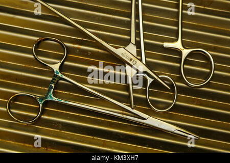 Surgical instruments lie on a table in a village clinic, Papua New Guinea Stock Photo