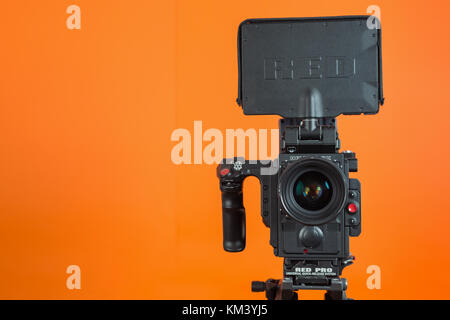 Professional video camera on vivid color background making contrast Stock Photo