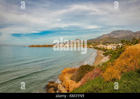 A view of one of the beaches by cliffs at Makrygialos on the Greek island of Crete. Stock Photo