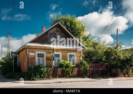 Typical Traditional Old Russian Wooden House In Village Or Countryside Of Belarus Or Russia Countries. Stock Photo