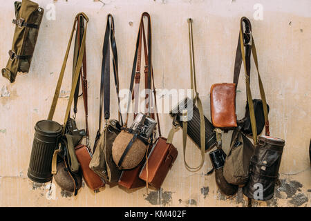 German Wehrmacht Infantry Soldier's Military Equipment Of World War II. Flasks And Bag Tank For Anti-gas Hanging In Wall. Stock Photo