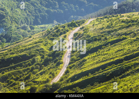 Road on the hill next to Dzhurynskyi waterfall in Dzhuryn river valley near Nyrkiv village in Zalischyky region, Ternopil Province, Ukraine Stock Photo