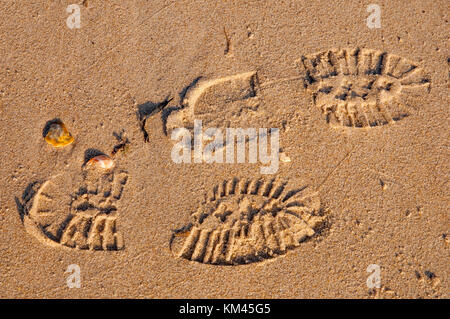 Shoe prints in the sand. Stock Photo