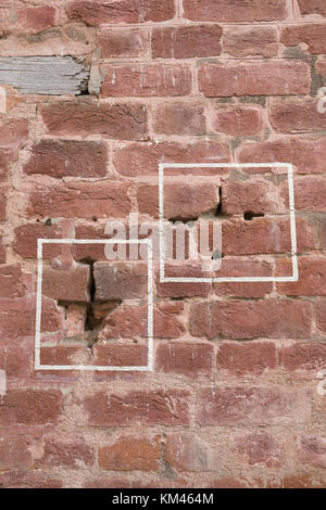 Machine gun bullet holes in brick wall at Jallianwala Bagh, Amritsar, where the British Army opened fire and massacred a crowd of unarmed protestors Stock Photo