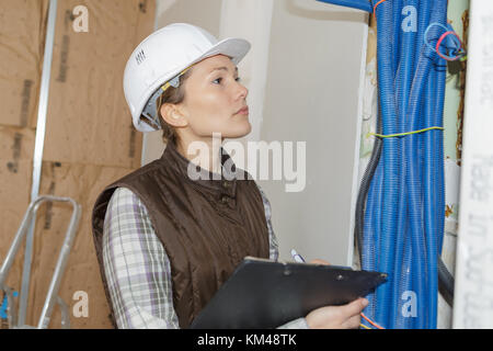 woman doing electrical inspection Stock Photo