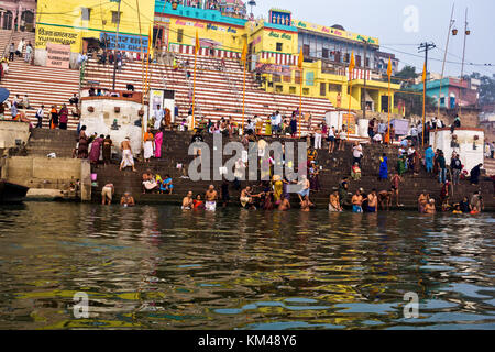 bathers in the holy river ganges, religious hindu people bathing at Kedar Ghat, banaras, India Stock Photo