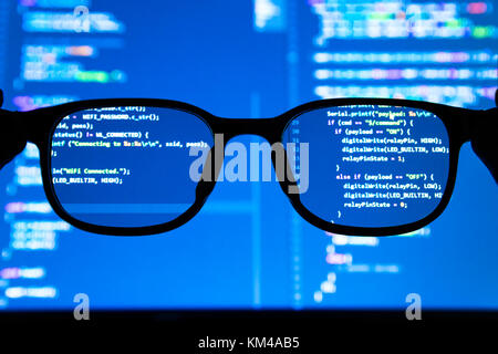 Data scientist , big data , artificial intelligence , machine learning technology concept. Silhouette glasses in front of laptop computer screen with  Stock Photo