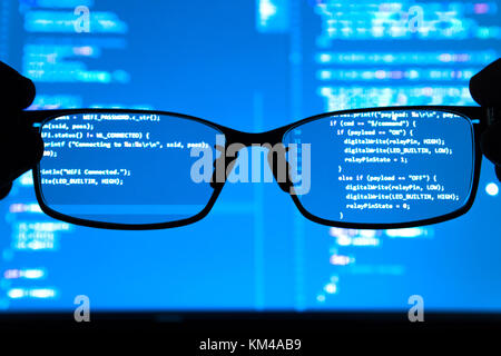 Data scientist , big data , artificial intelligence , machine learning technology concept. Silhouette glasses in front of laptop computer screen with  Stock Photo
