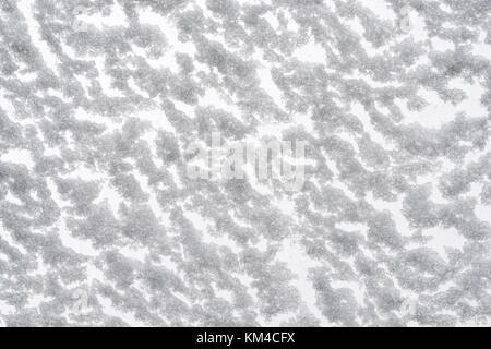 White snow texture. Snow-covered glass bottom view. Christmas and New Year background. Stock Photo