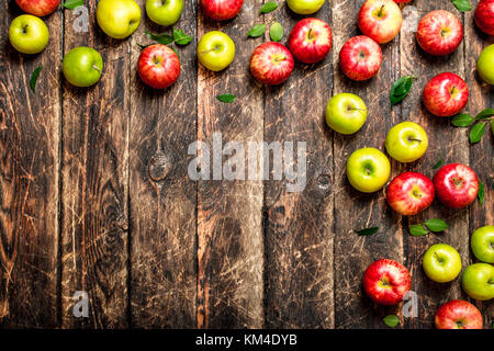 Red and green apples . On wooden background. Stock Photo