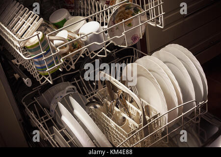 Clean dishes and accessories in dishwasher after washing. Stock Photo