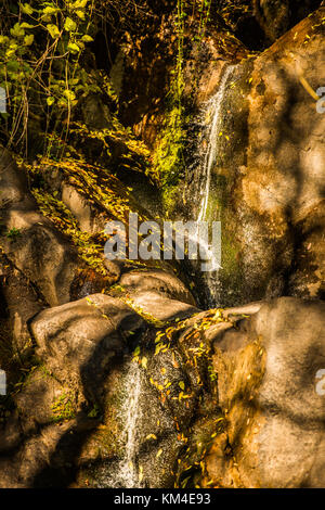 One of the waterfalls of the Garganta de las Nogaledas falling among the rocks, Jerte, Extremadura, Spain. Stock Photo