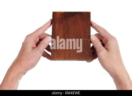 The old artist holds in his hands a wooden tablet  on which he will draw an icon of the Virgin Mary. Isolated on white top view concept photo Stock Photo