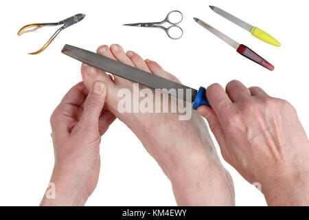 Real problems with leg nails in older men can be solved with a coarse steel file. Isolated on white studio concept shot Stock Photo