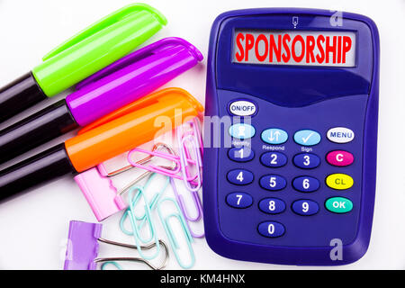 Writing word Sponsorship text in the office with surroundings such as marker, pen writing on calculator. Business concept for Word Cloud Concept white Stock Photo