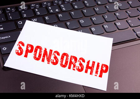 Writing Sponsorship text made in the office close-up on laptop computer keyboard. Business concept for Word Cloud Concept Workshop on the black backgr Stock Photo