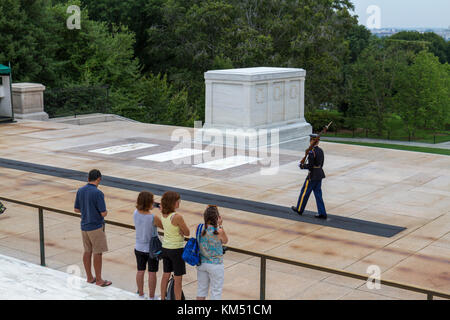 A Guard walking in front of the Tomb of the Unknowns, Arlington National Cemetery, Virginia, USA. Stock Photo