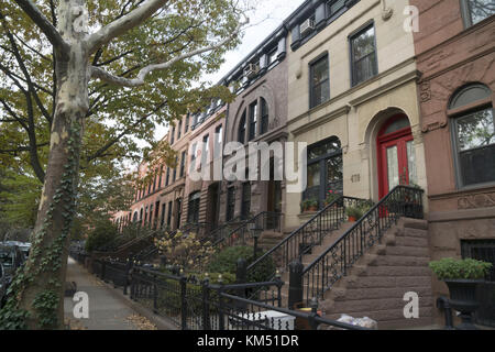 High stoop brownstones and limestones on a residential block in Park Slope, Brooklyn, New York. Stock Photo