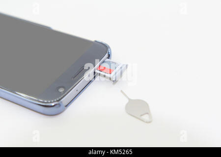 Remove memory card of smartphone Stock Photo