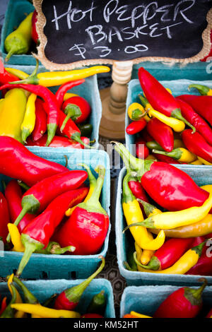 Fresh ripe organic peppers at the weekend farmer's market in Penticton, British Columbia, Canada. The farmer's market sells fresh produce from local o Stock Photo