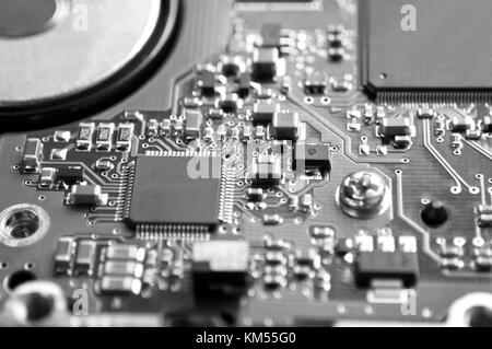 Digital hardware closeup. Microchips and condensers assembly on the circuit board macro Stock Photo