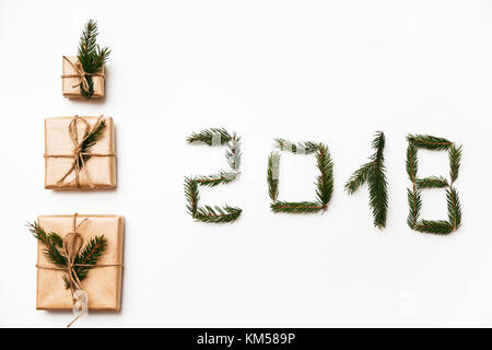 Christmas composition. Christmas gift, 2018 made of fir branches. Flat lay, top view Stock Photo