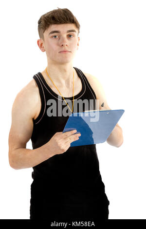Teenage personal trainer writing on a clipboard isolated on a white background Stock Photo