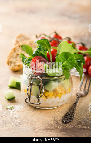Salad in glass jar Stock Photo