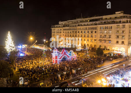 Thessaloniki, Greece - November 30, 2017: Crowd of people in Aristotle's square in Thessaloniki sees the Christmas tree during the Christmas Period.   Stock Photo