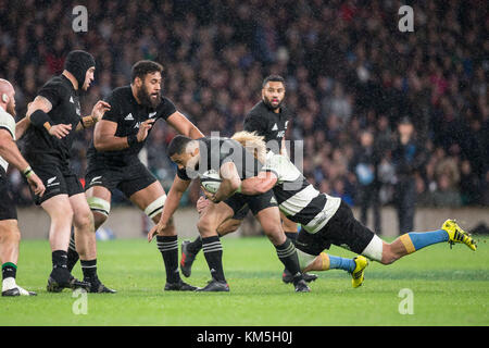 London, UK. 04th Nov, 2017. Barbarians' Willie Britz (19) succesfully tackling Ngani Laumape (All Blacks, 12), who was carrying the ball, during the Killik Cup rugby match between Barbarians FC and New Zealand in London, United Kingdom, 04 November 2017. Jeffery Toomaga-Allen (All Blacks, 18) and Patrick Tuipulotu (All Blacks, 19) lurk to the left. Credit: Jürgen Keßler/dpa/Alamy Live News Stock Photo