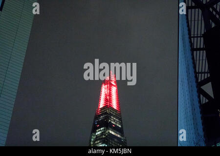 London, UK. 4th Dec, 2017. The Shard Christmas Light Show is launched. The installation, described as Europe's highest light show is projected from the top of the 95-storey London Bridge skyscraper. Copyright CarolMoir/AlamyLiveNews. Credit: carol moir/Alamy Live News Stock Photo