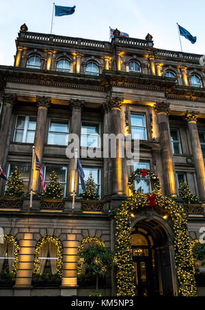 George Street, Edinburgh, Scotland, United Kingdom, 4th December 2017. Edinburgh Christmas decorations  at The Principal Hotel, formerly The George Hotel, with Winter dusk sunlight reflected in the windows Stock Photo