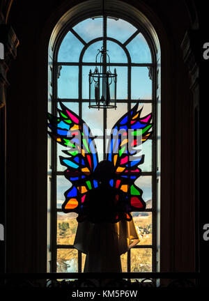 Castle Howard, UK. 5th December, 2017. 'Angels On High' the Christmas display inspired by Castle Howards art collections, architecture and interiors, is the vision of creative producer Charlotte Lloyd Webber and theatrical designer Bretta Gerecke. Coloured glass is used to create multicoloured angel wings se against the arched windows of the house. The exhibition runs until 23rd December. Photo Bailey-Cooper Photography/Alamy Live News Stock Photo