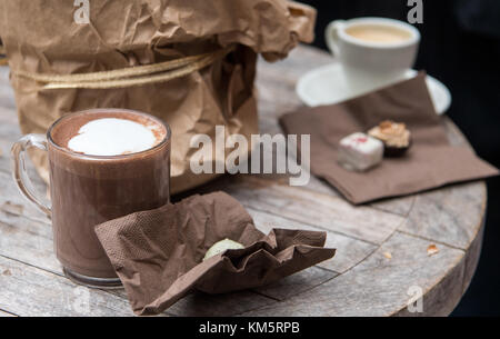 Tuebingen, Germany. 05th Dec, 2017. A glass full of hot chocolate stands on a table at the chocolate market 'chocolART' during the first day of its opening in Tuebingen, Germany, 05 December 2017. The market will offer chocolate-related goodies until 10 December 2017. Credit: Sebastian Gollnow/dpa/Alamy Live News Stock Photo